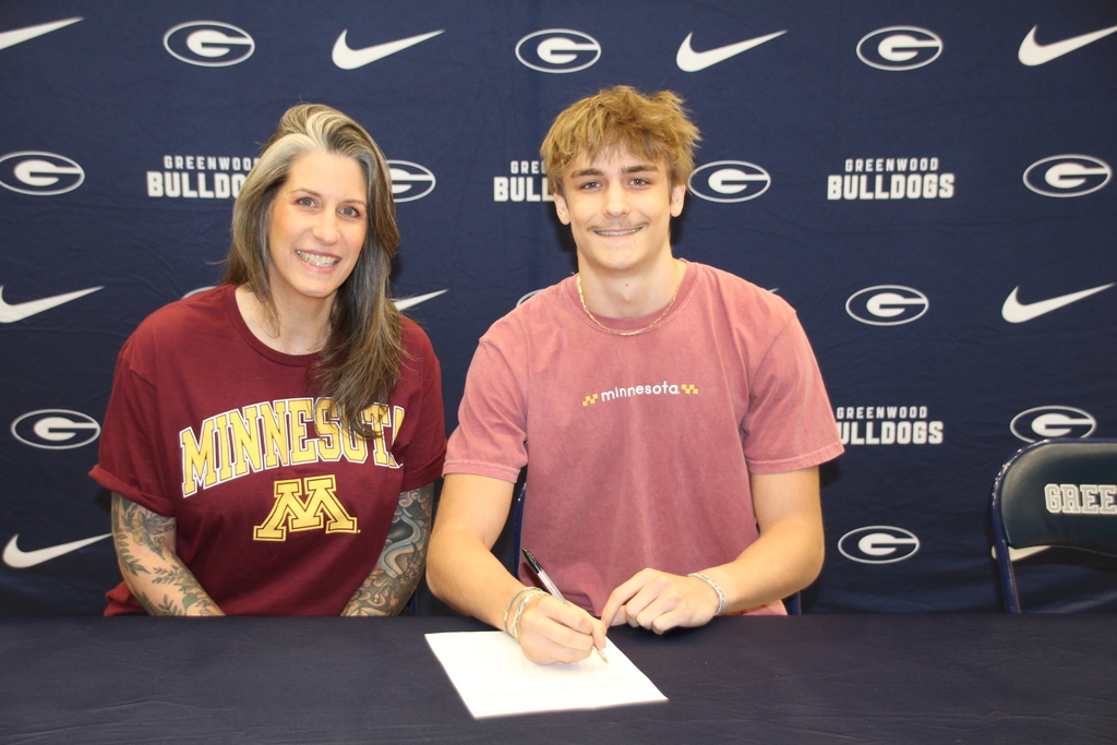 Luke Brandt and Mom signing