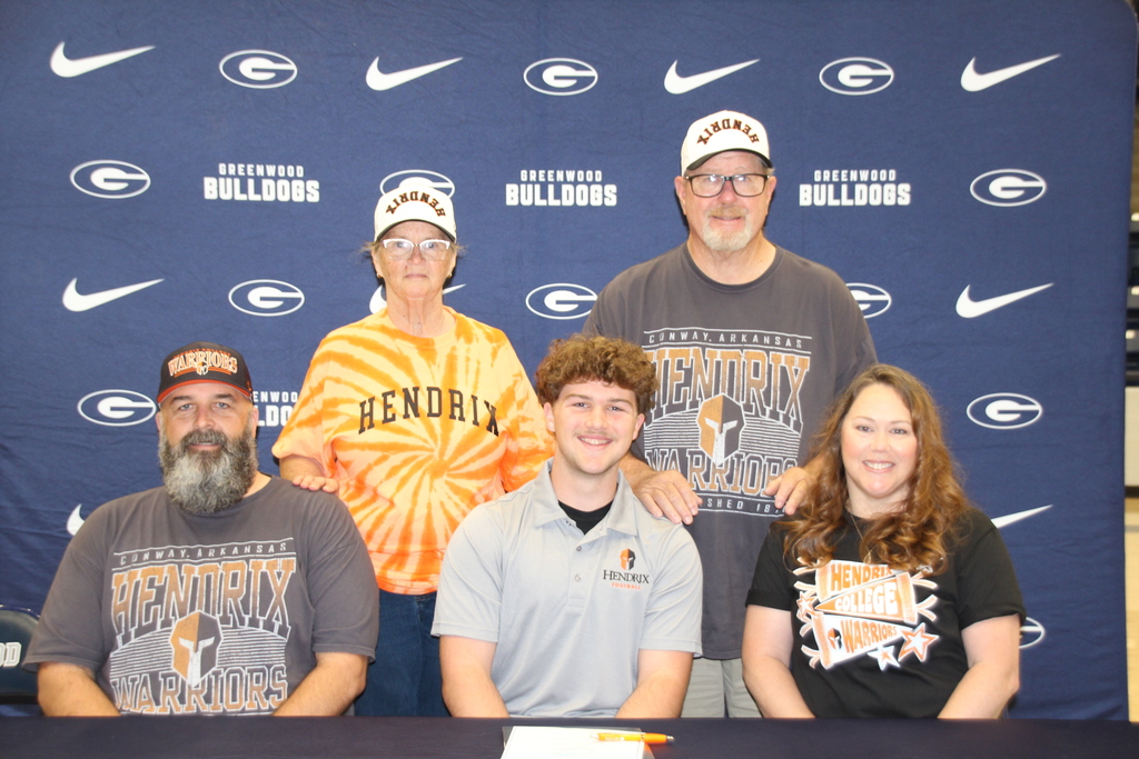 Wyatt with parents and grandparents smiling