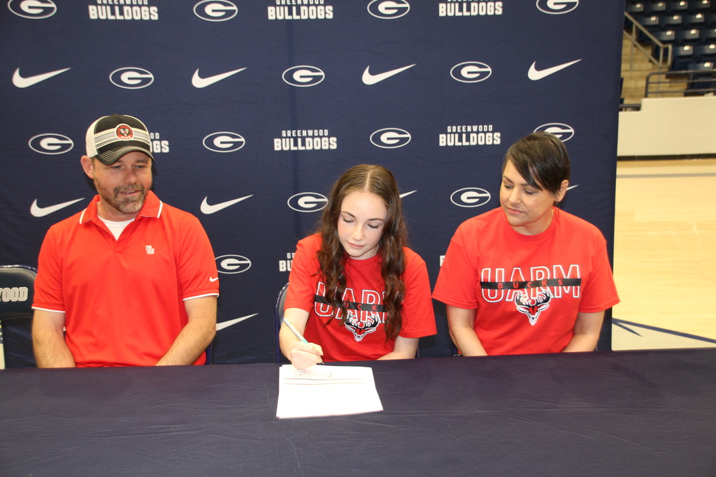 Lexi signing with parents