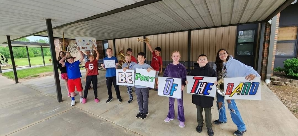 band student with signs to join band