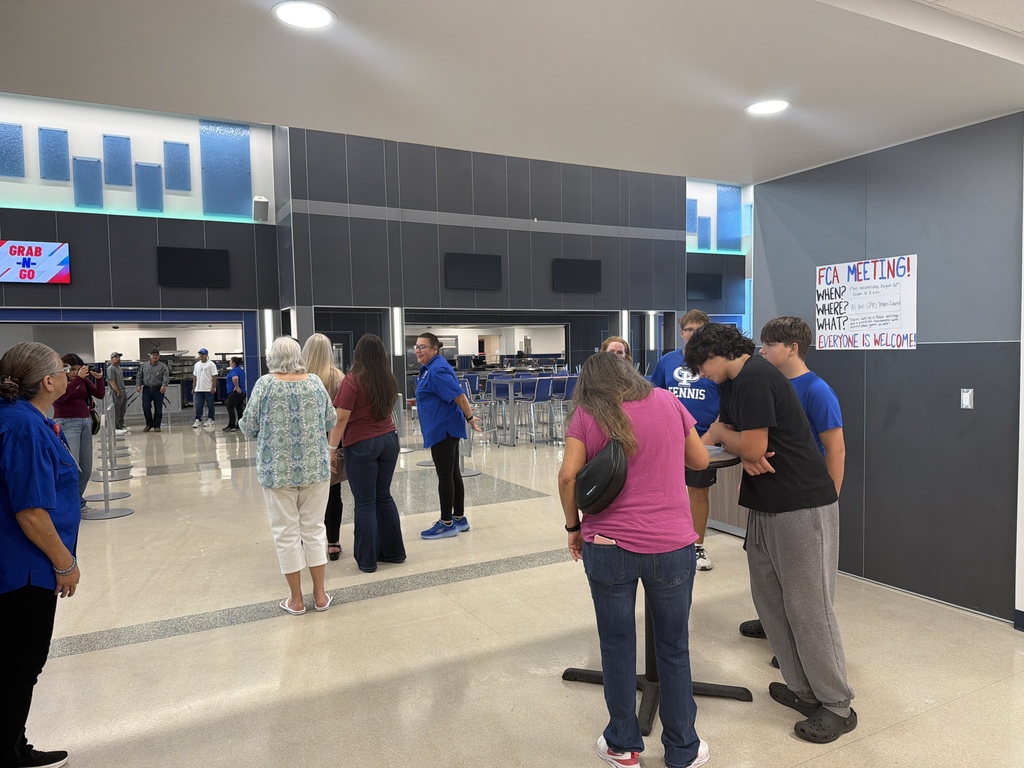 People checking out the cafeteria at the high school  