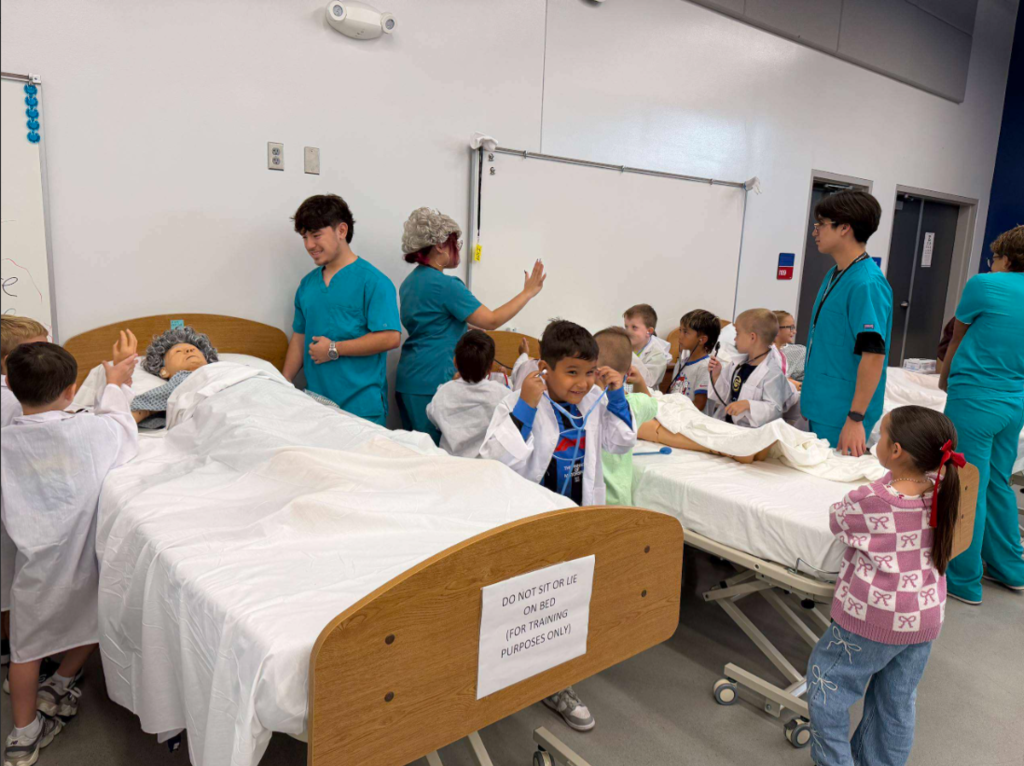A group of medical professionals gathered around hospital beds, interacting with patients