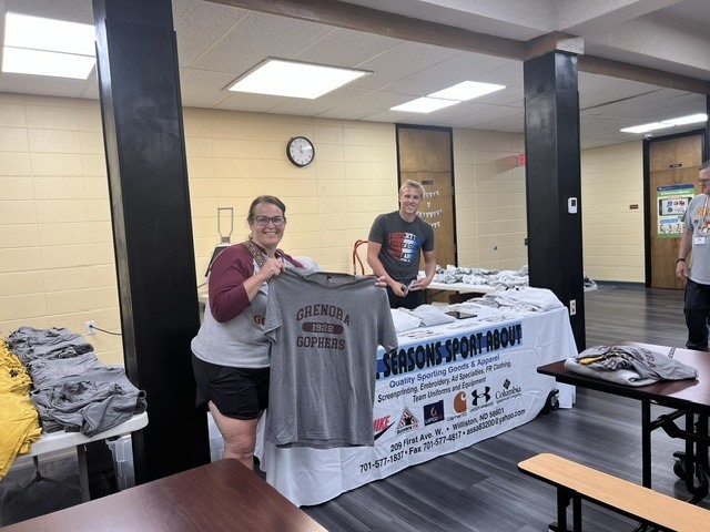 Principal April Madesen is proudly showing off her new Grenora shirt during the All-Class Reunion celebration!  A big thank you to All Seasons Sport About for printing Grenora apparel on-site in the Grenora School cafeteria until 5:00 PM today.  If you're at the reunion, be sure to stop by and pick up your Grenora gear. Go Gophers!