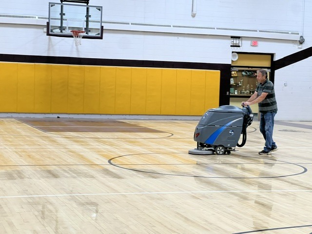 Summer maintenance is in full swing! Brett is busy getting the gym floor ready for its annual stripping and refinishing. Preparing the floor is an important first step in the process and helps ensure a quality finish that will have the gym looking its best for the upcoming school year. Thank you, Brett, for your hard work and dedication to keeping our campus in great shape!