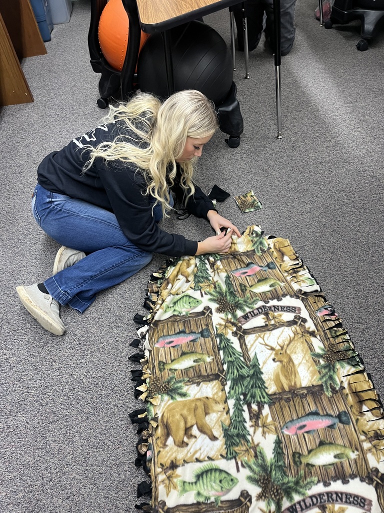 Seniors making Tie-Blankets