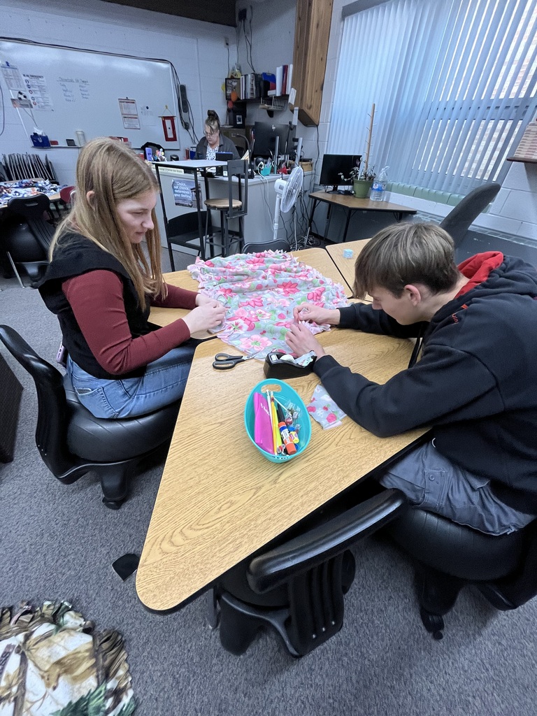Seniors making Tie-Blankets
