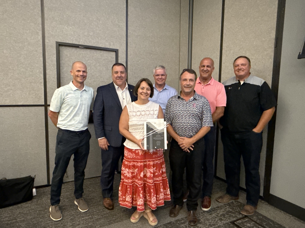The six members of the Gretna Public School board and Superintendent standing with their President's Award for NASB