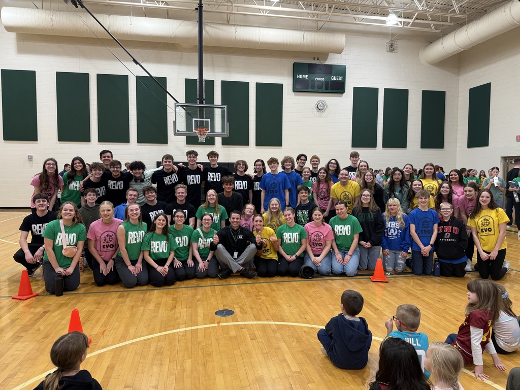 Gretna High School choir students who attended Thomas Elementary pictured with Mr. Basye in the gym.
