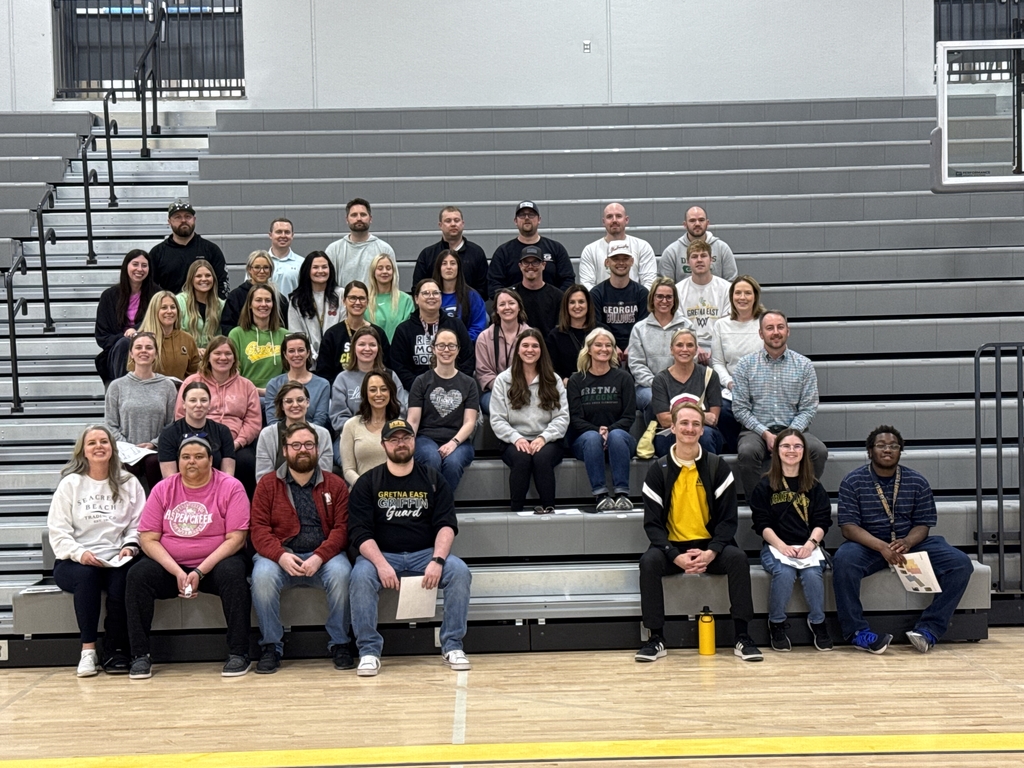 Future Giles Creek Staff Members posing for a picture sitting in the bleachers of the gym