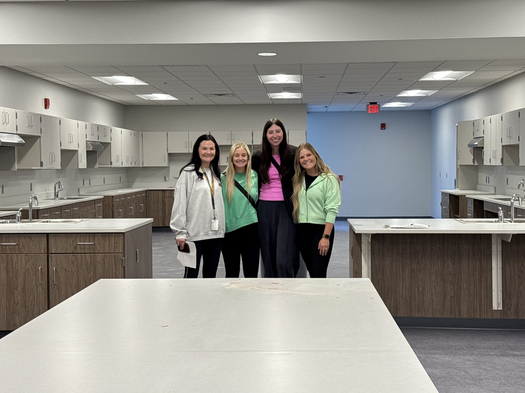 Future Giles Creek Staff Members posing for a picture standing in the FCS room 