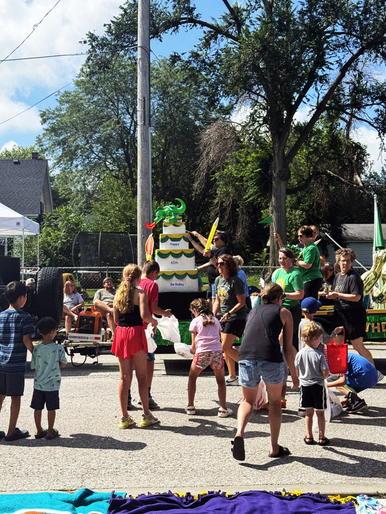 Gretna Days parade with float of a Gretna schools birthday cake celebrate 65 years
