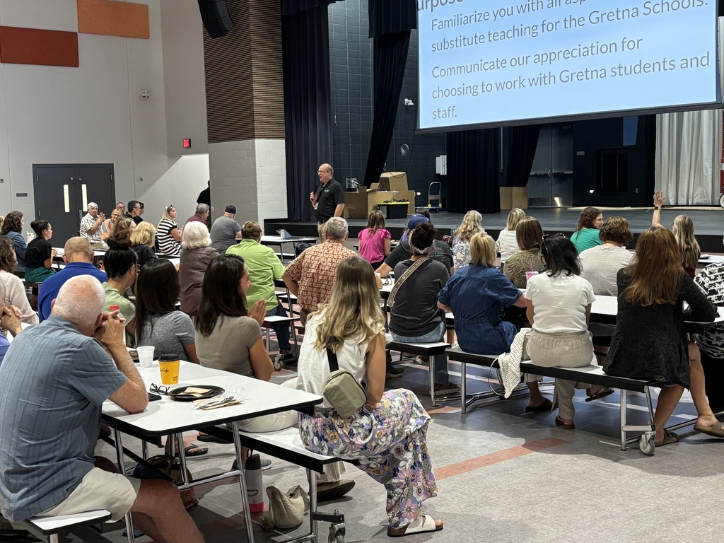 all Gretna Public schools substitute teachers sitting in the cafeteria listening to a presenter 