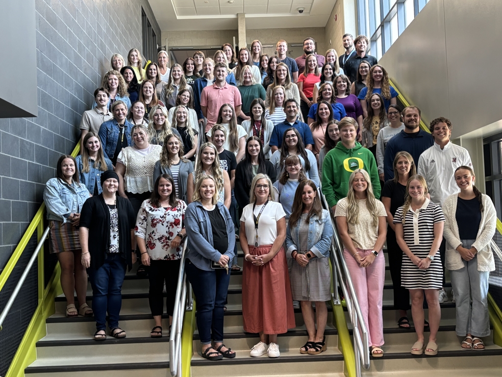 photos of all new staff to Gretna Public Schools - 76 new staff members on the stairs inside Aspen Middle School