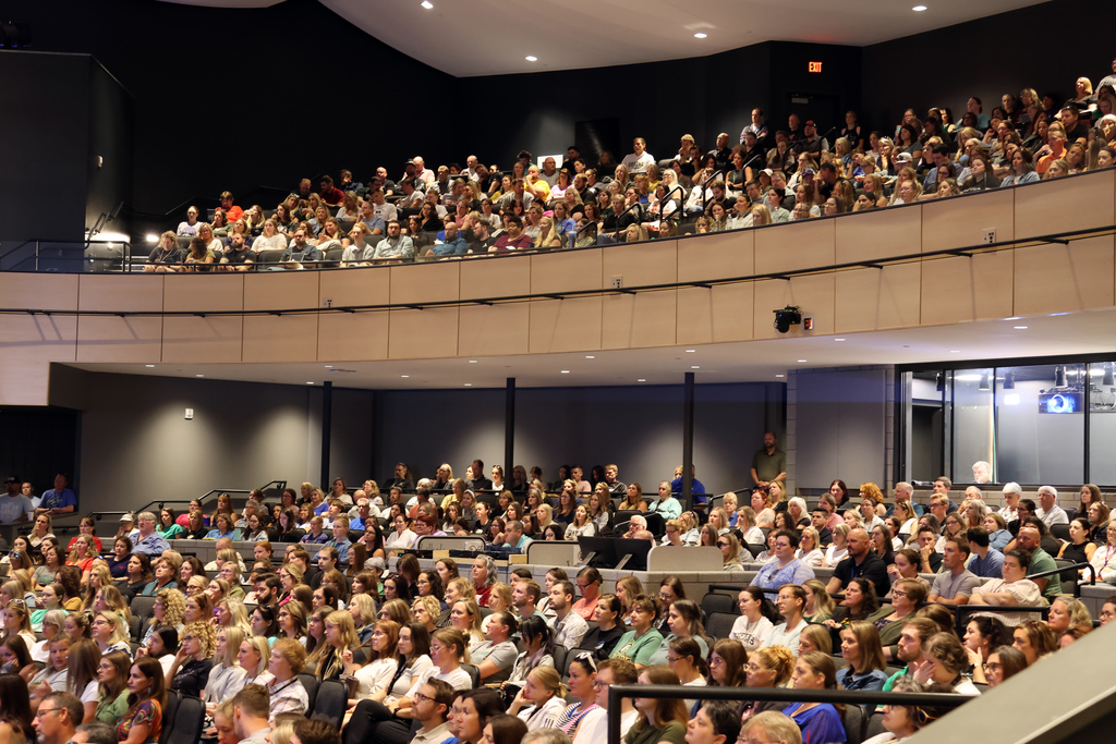 Gretna East auditorium filled with all staff gathering for speech for new year