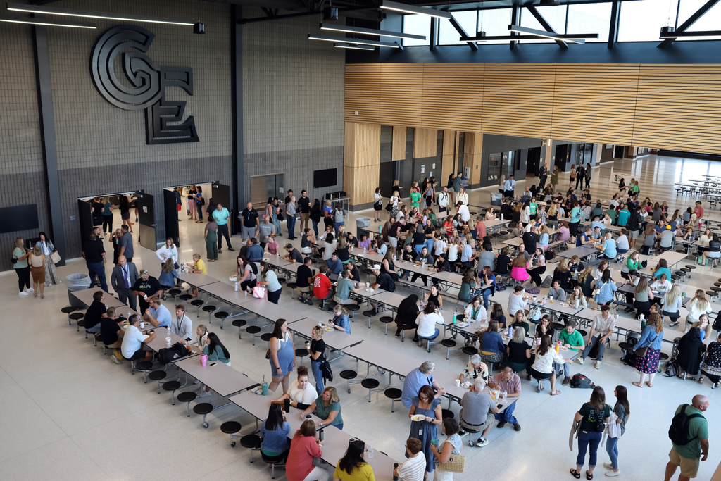 Gretna East cafeteria tables filled with staff members gathering for breakfast