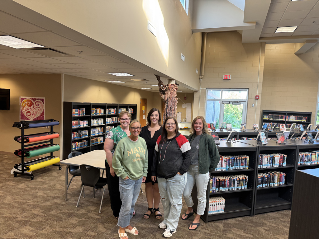 Middle School and High School librarians gathered in Gretna High School library posing for a picture