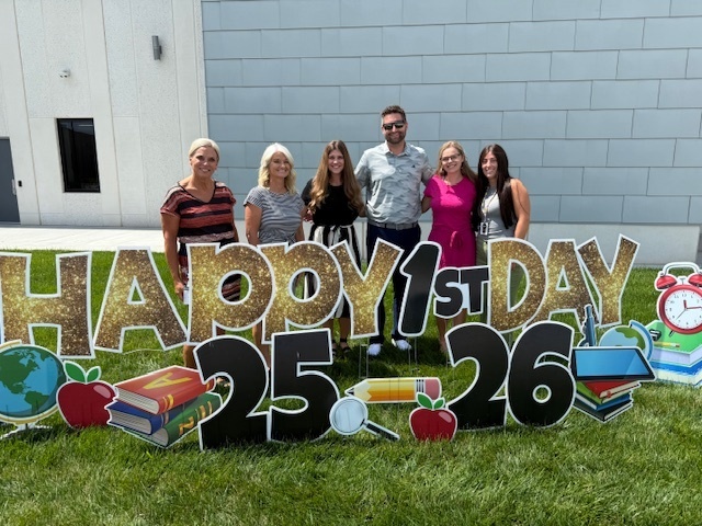 6 adults celebrating the first day of school getting ready to teach