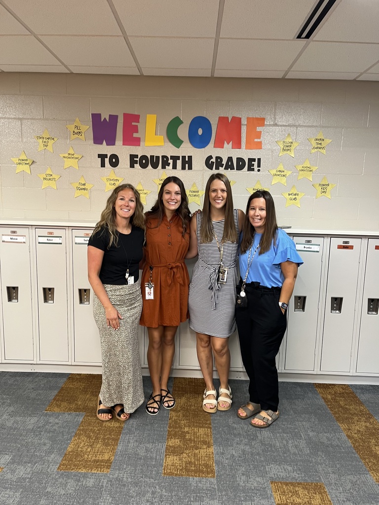 teachers smiling for a picture