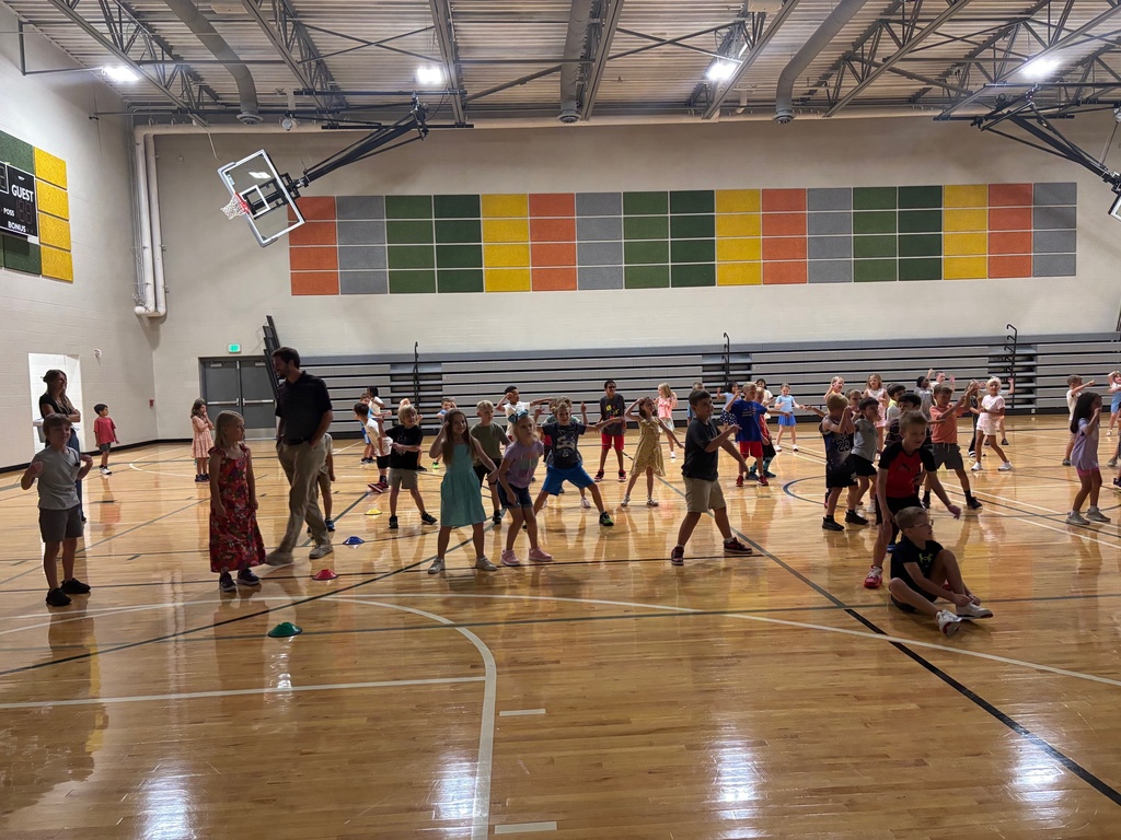 students dancing in the gym