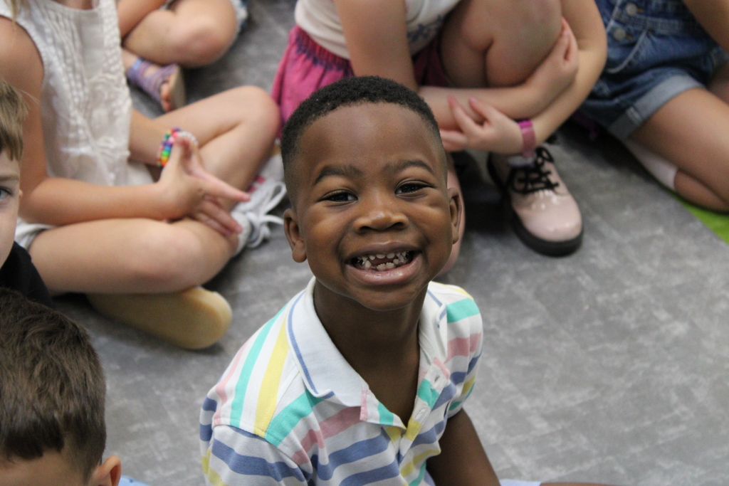 The student shows his excitement for the first school assembly. 