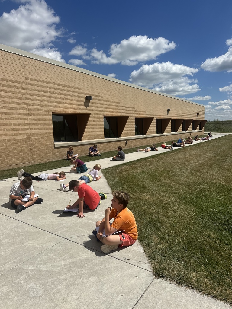 Students writing outside