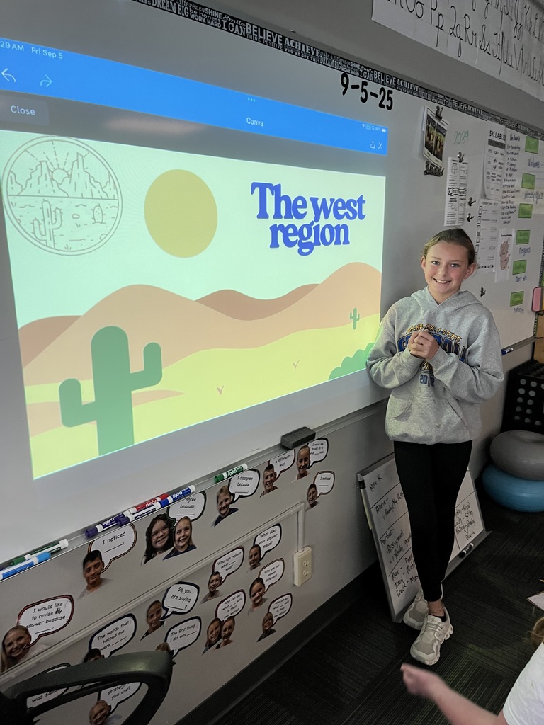 Girl standing in front of a whiteboard with a map of the west region.
