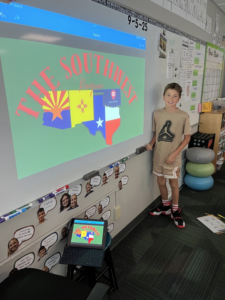 Boy standing in front of a whiteboard with a presentation of the southwest region.