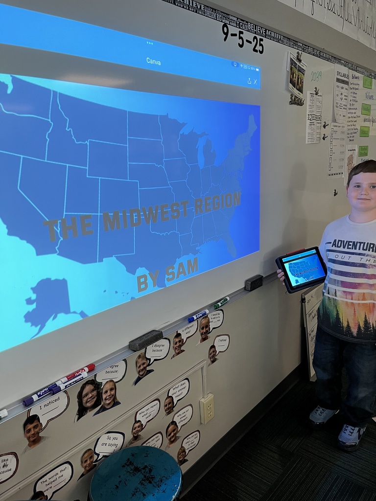 Boy standing in front of a whiteboard with a presentation of the midwest region.