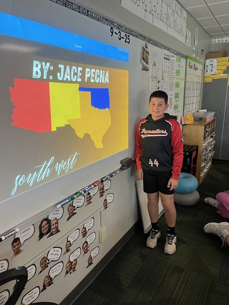 Boy standing in front of a whiteboard with a presentation of the southwest region.