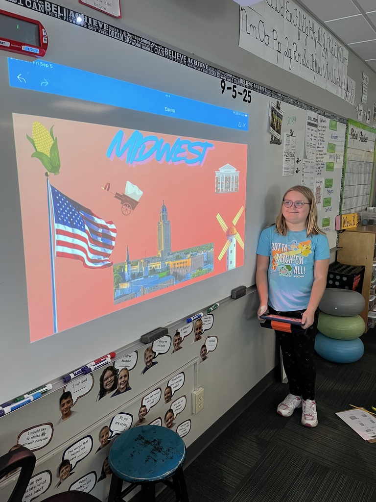 Girl standing in front of a whiteboard with a presentation of the midwest region.