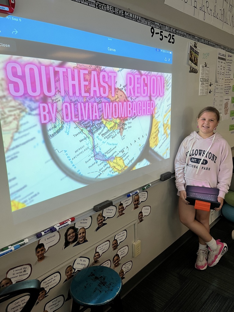Girl standing in front of a whiteboard with a presentation of the southeast region.