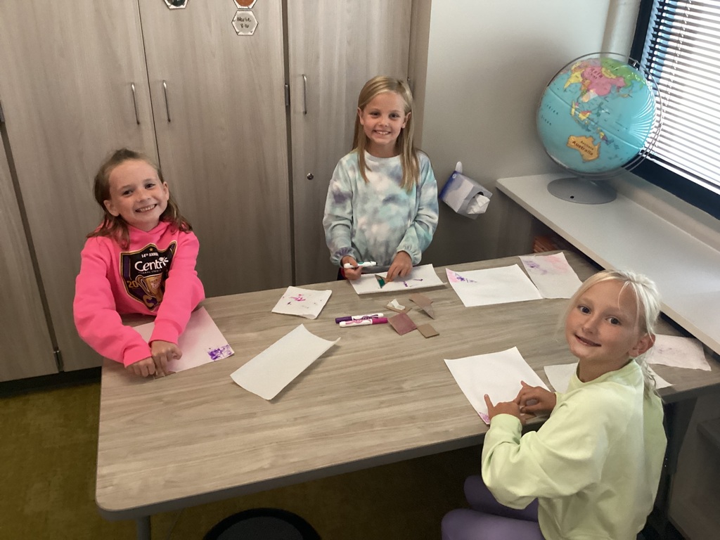 students working on art in a classroom
