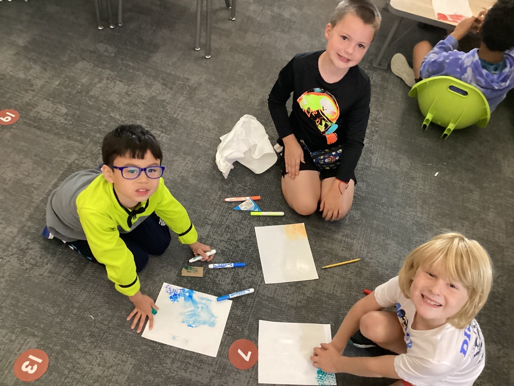 students working on art in a classroom