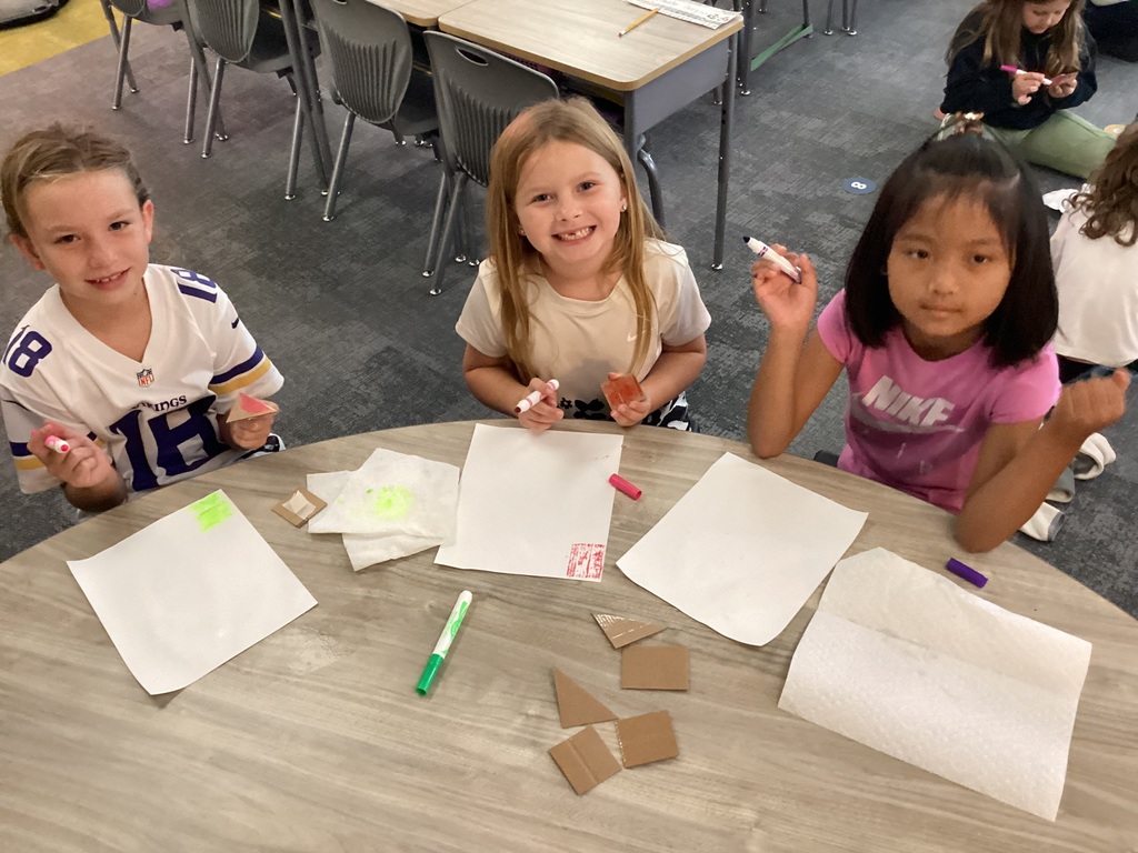 students working on art in a classroom