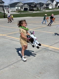 kids playing round up games outside