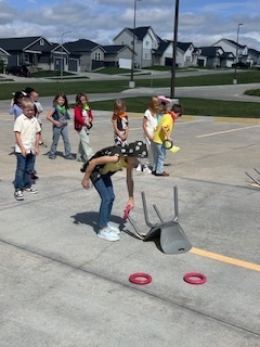 kids playing round up games outside
