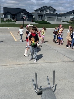 kids playing round up games outside