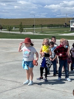 kids playing round up games outside