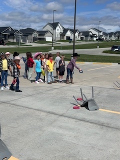 kids playing round up games outside