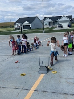 kids playing round up games outside