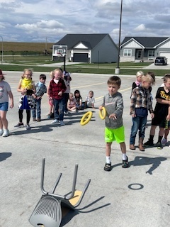 kids playing round up games outside