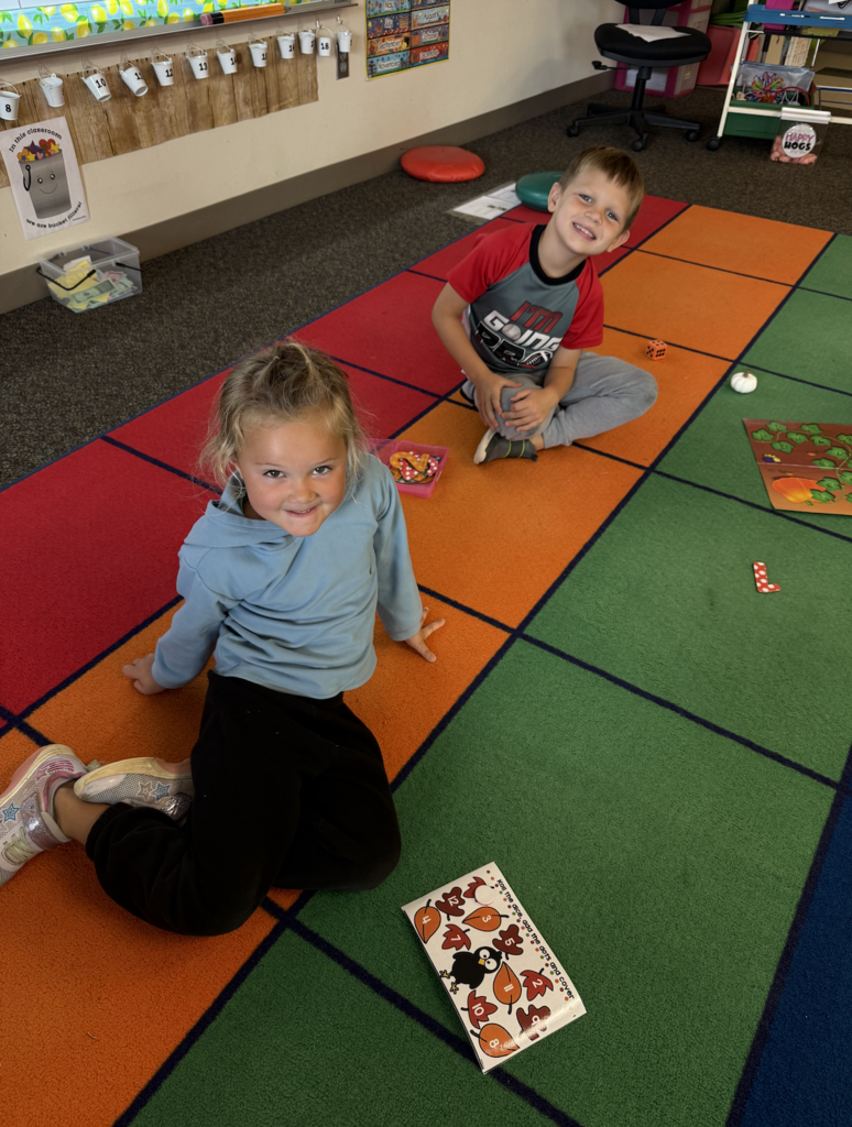 Two students are playing fall themed math games.