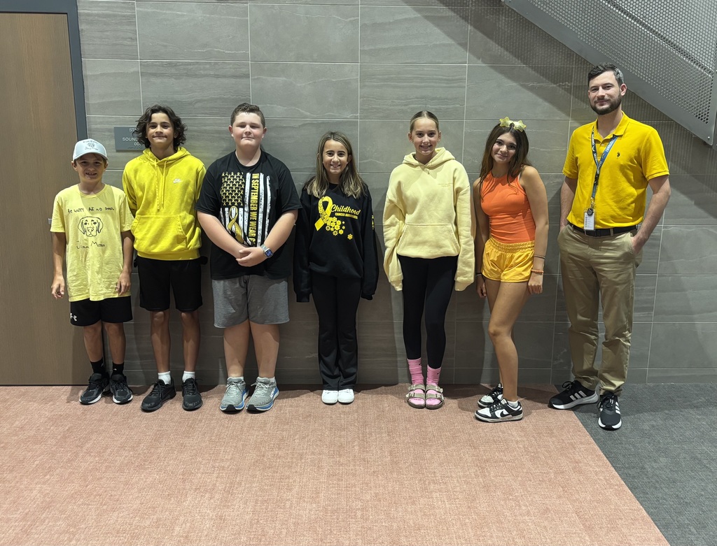 Staff and students wearing yellow to support a classmate. 