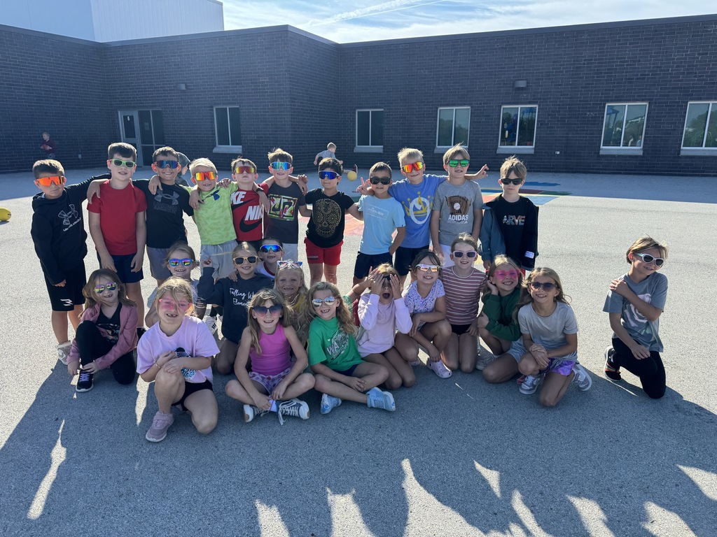 Second graders outside wearing sunglasses