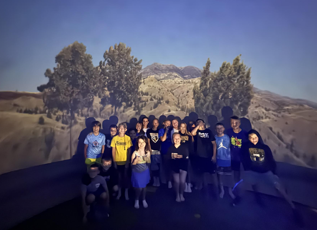 This is a picture of Ms. Ferzley's class posing inside the planetarium.