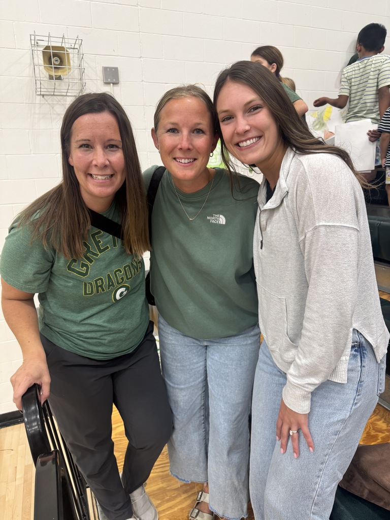 students cheering at a volleyball game