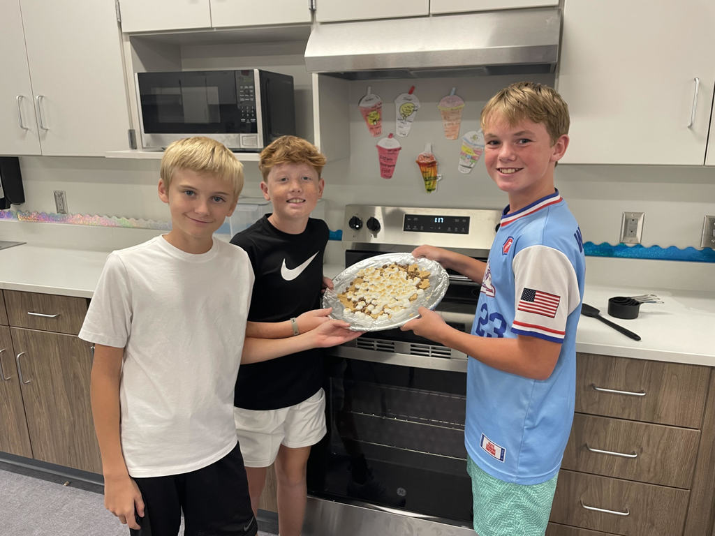 6th grade students showing their smores nachos.