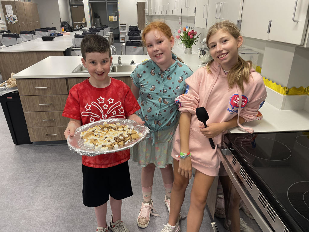 6th grade students showing their smores nachos.