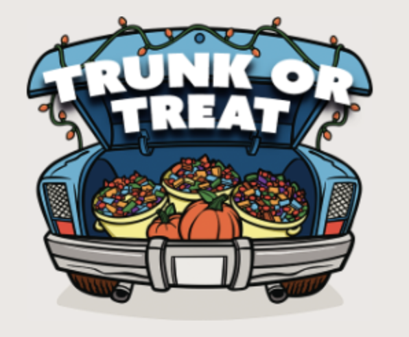 Photo showing a car trunk opened with candy inside showing Trunk or Treat.