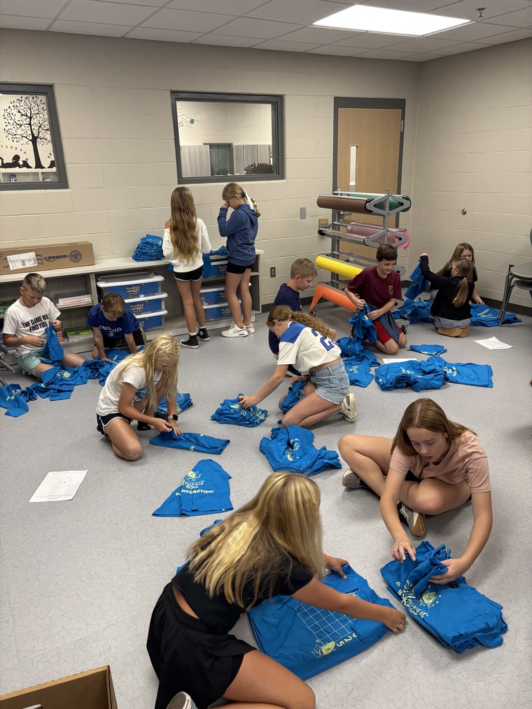Students organizing and distributing tshirts